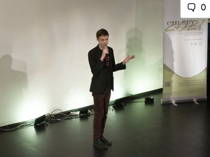 Host speaking at the Cherry Saxophone Competition