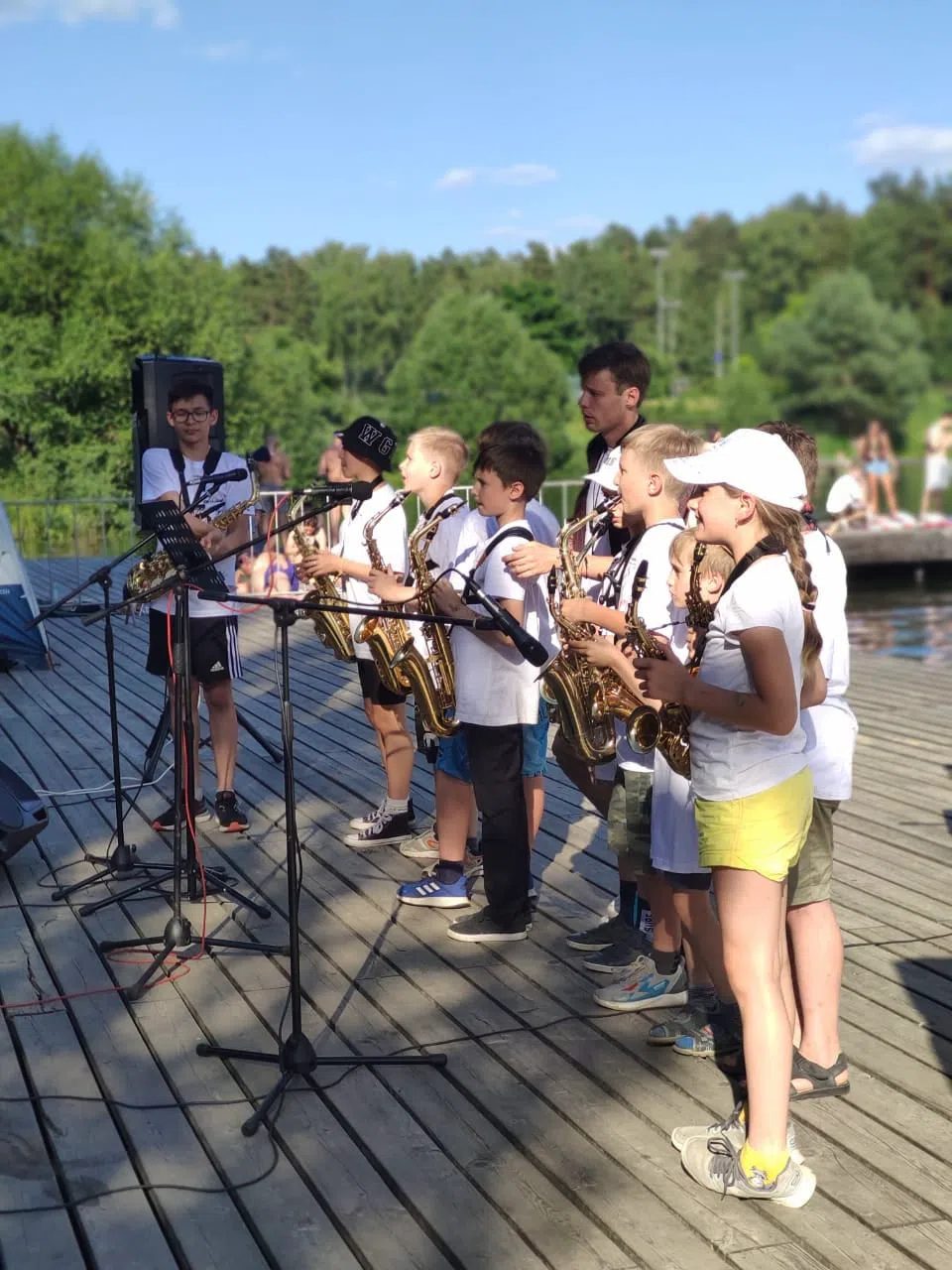 Young saxophonists performing at camp
