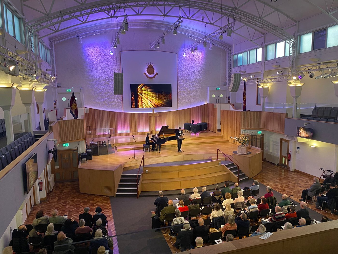Denis Patrickson performing with pianist on stage